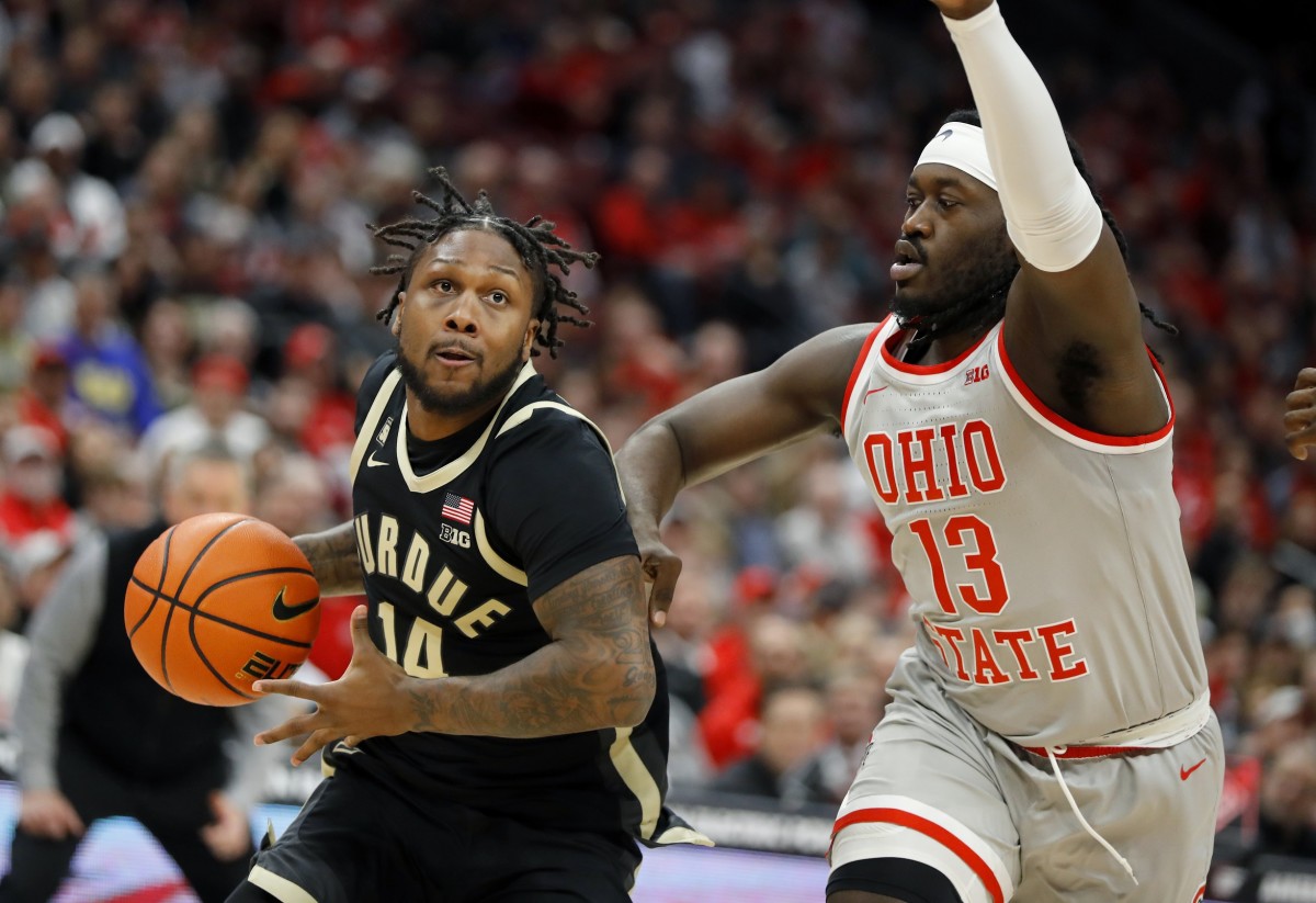 Jan 5, 2023; Columbus, Ohio, USA; Purdue Boilermakers guard David Jenkins Jr. (14) drives past Ohio State Buckeyes guard Isaac Likekele (13) during the first half at Value City Arena.