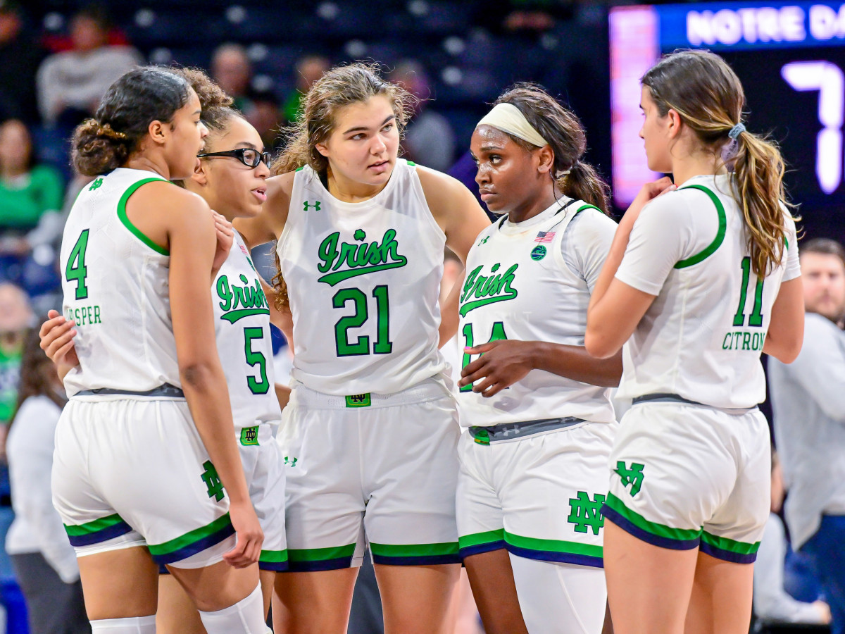 Notre Dame guard Cassandre Prosper, guard Olivia Miles, forward Maddy Westbeld, guard KK Bransford, and guard Sonia Citron  huddle in the second half against the Boston College Eagles.