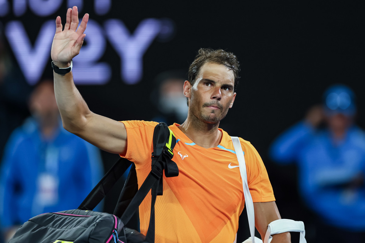 Rafael Nadal waves to fans after being upset at the 2023 Australian Open.
