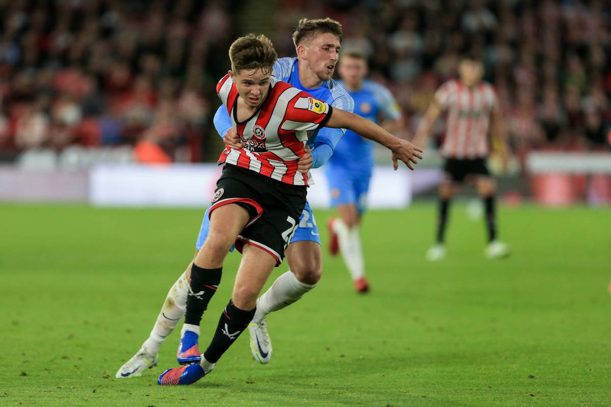 Neil pulling down McAtee after losing possession. 