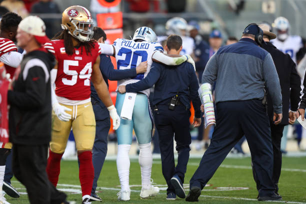 Trainers help Pollard off the field after his injury in January.
