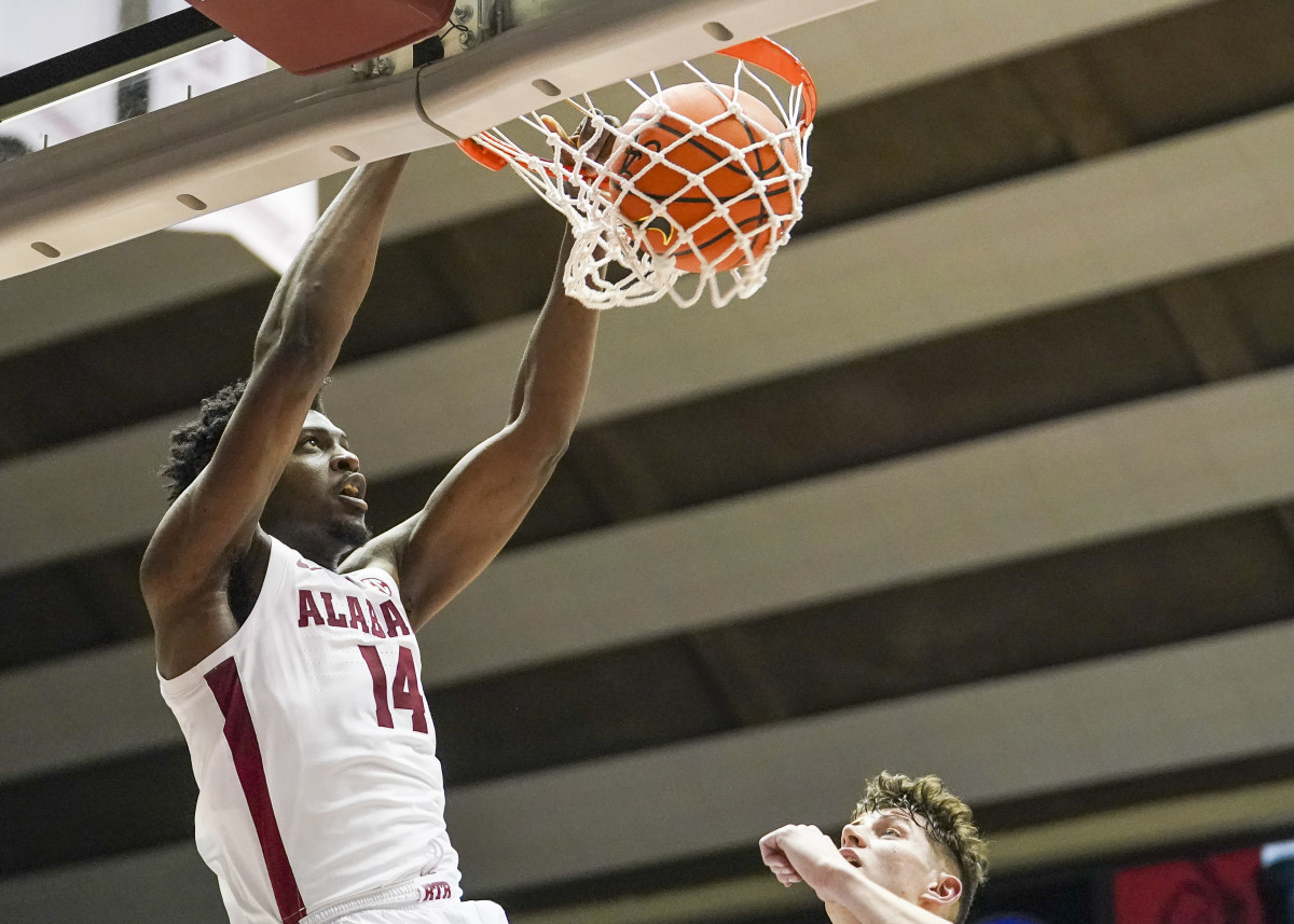 Alabama Crimson Tide center Charles Bediako (14) dunks the ball against the Vanderbilt Commodores during the second half at Coleman Coliseum.