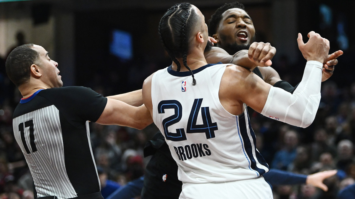Cleveland Cavaliers guard Donovan Mitchell (45) throws a punch at Memphis Grizzlies forward Dillon Brooks