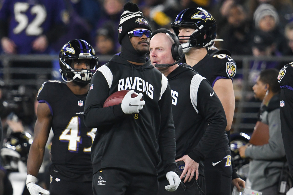 Lamar Jackson on the sideline of a Ravens game he missed due to injury