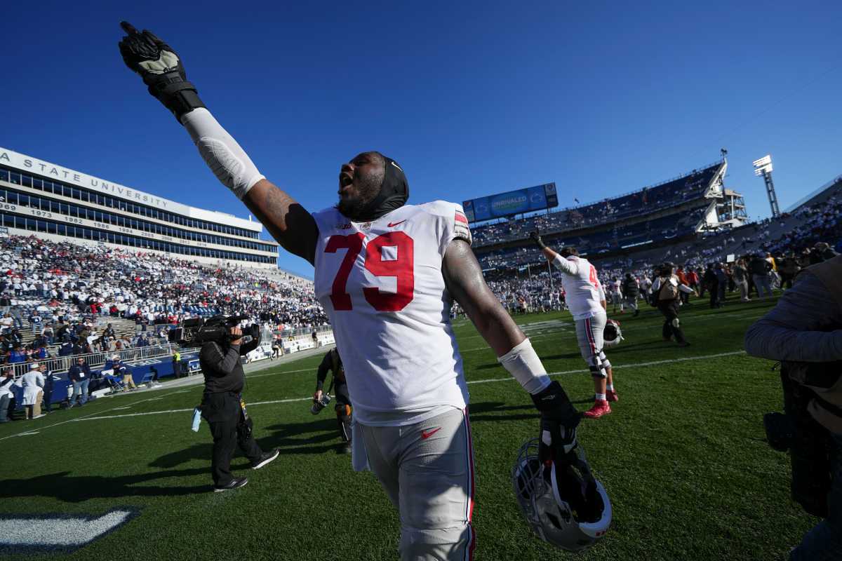Oct 29, 2022; University Park, Pennsylvania, USA; Ohio State Buckeyes offensive linemen Dawand Jones (79) waves to the fans following the NCAA Division I football game against the Penn State Nittany Lions at Beaver Stadium. Ohio State won 41-33. Mandatory Credit: Adam Cairns-The Columbus Dispatch Ncaa Football Ohio State Buckeyes At Penn State Nittany Lions