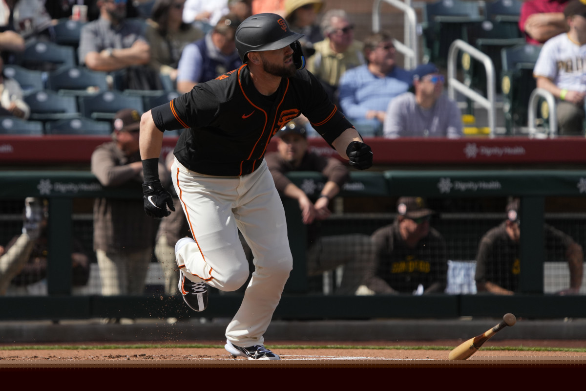 SF Giants right fielder Mitch Haniger (17) hits against the San Diego Padres in the first inning at Scottsdale Stadium. (2023)