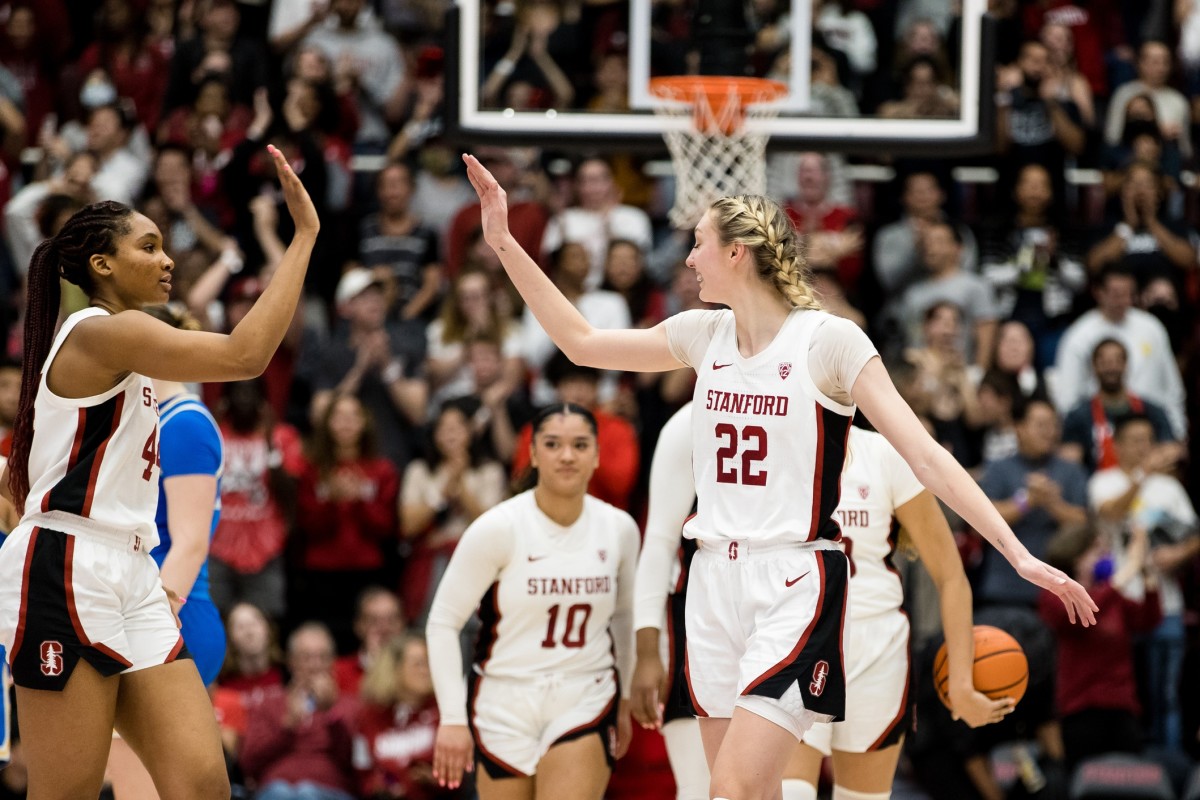 Feb 20, 2023; Stanford, California, USA; Stanford Cardinal forward Cameron Brink (22) and forward Kiki Iriafen (44) celebrate their 71-66 victory over UCLA Bruins at Maples Pavilion.