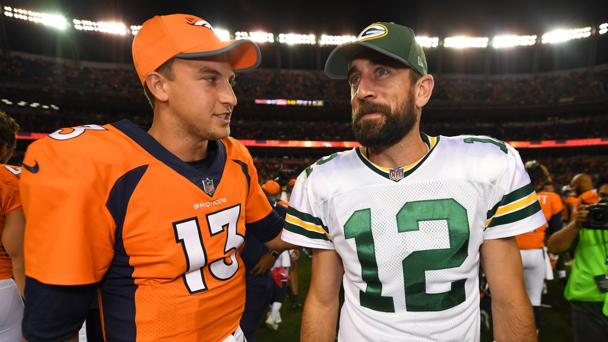 Aaron Rodgers and Trevor Siemian speak following the Packers-Broncos preseason game in Denver in 2017. (Photo by Ron Chenoy/USA Today Sports)