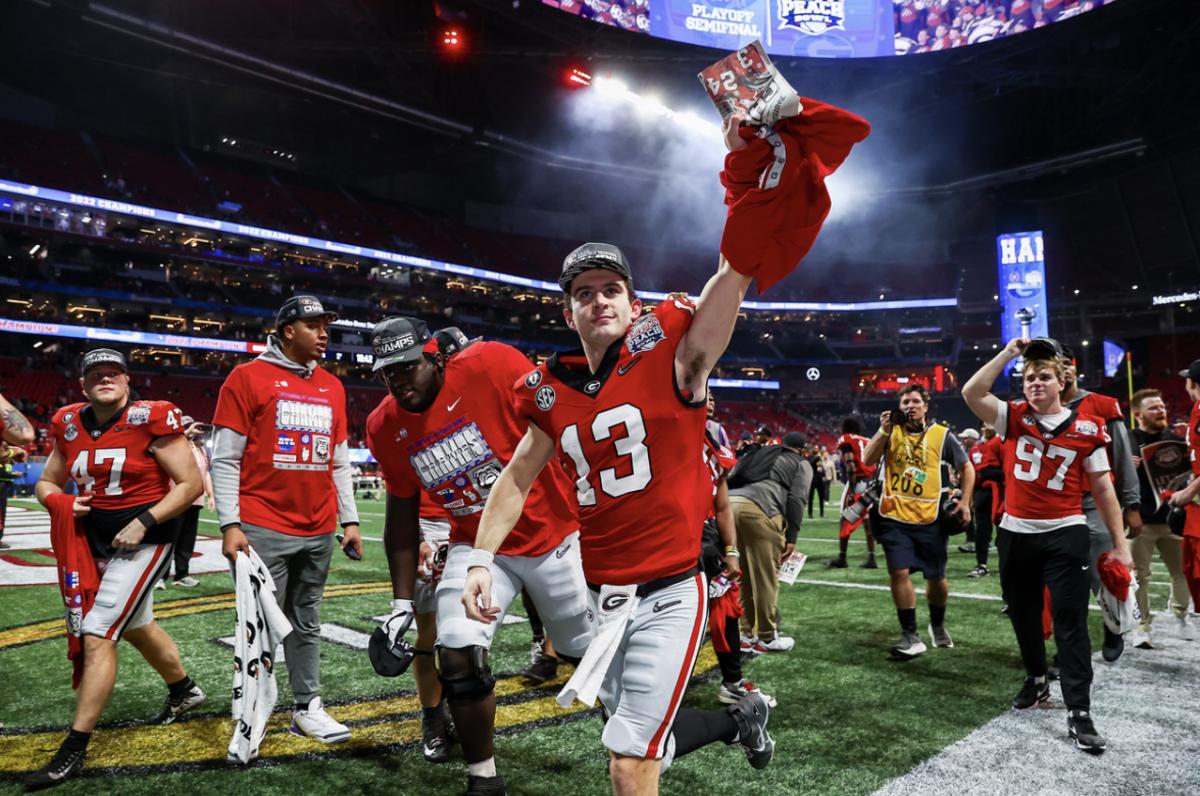 Quarterback Stetson Bennett celebrates after Georgia's 2023 Peach Bowl victory (Photo by Tony Walsh)