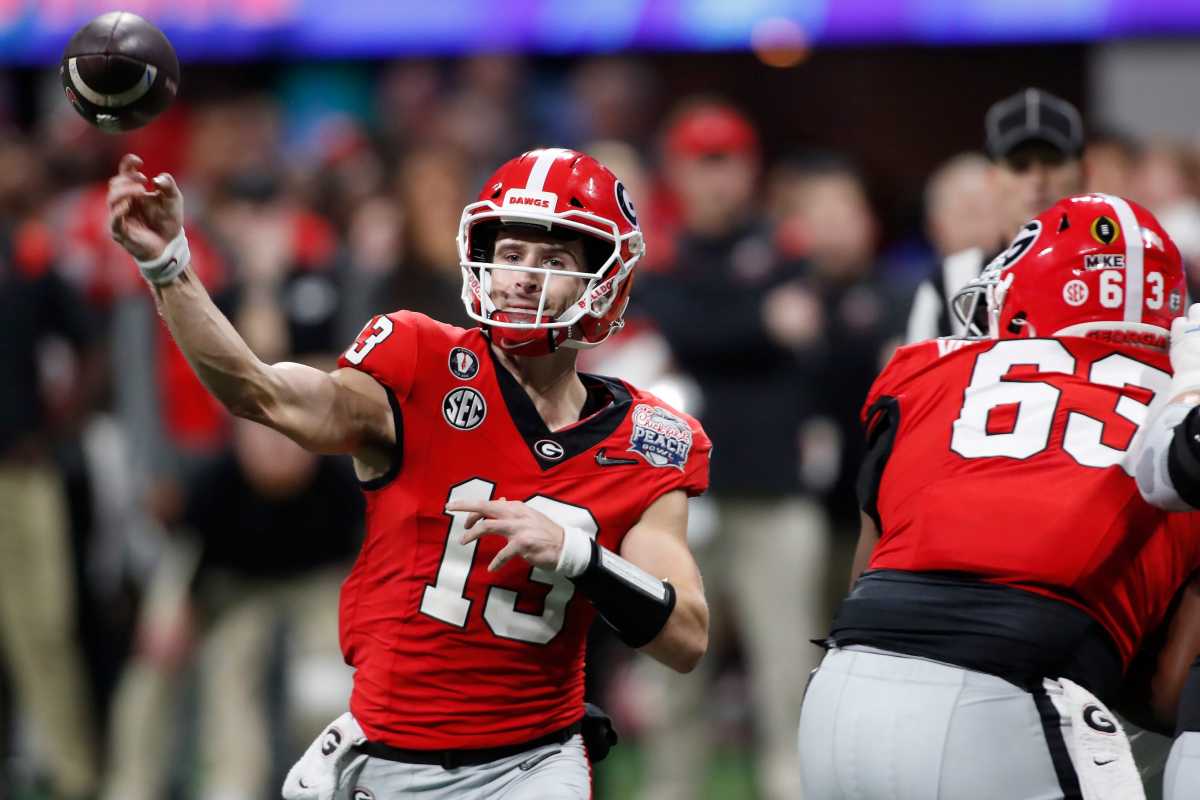 Georgia quarterback Stetson Bennett (13) throws a pass during the second half of the Chick-fil-A Peach Bowl NCAA College Football Playoff semifinal game between Ohio State and Georgia on Saturday, Dec 31, 2022, in Atlanta. Georgia won 42-41. News Joshua L Jones Syndication Online Athens