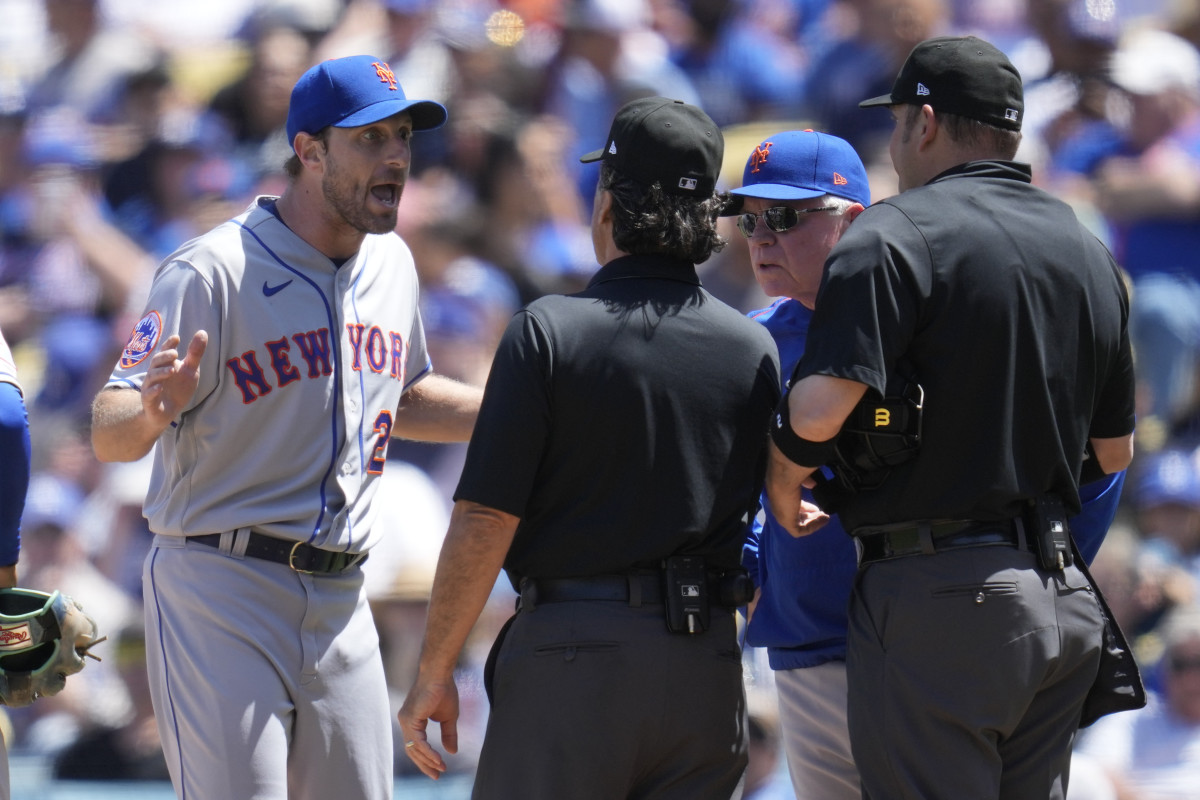 Max Scherzer argues with an umpire after being checked for a sticky substance during a MLB game.