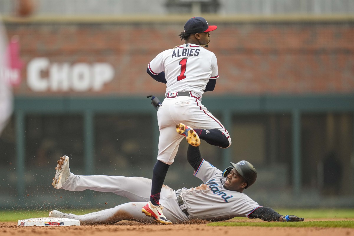 Apr 27, 2023; Cumberland, Georgia, USA; Atlanta Braves second baseman Ozzie Albies (1) forces out Miami Marlins right fielder Jesus Sanchez (7) before throwing to first base during the second inning at Truist Park.