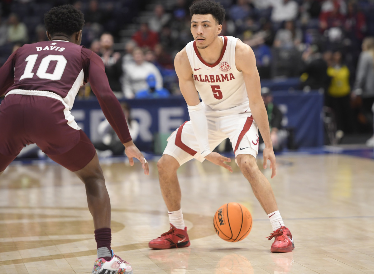 Mar 10, 2023; Nashville, TN, USA; Alabama Crimson Tide guard Jahvon Quinerly (5) dribbles as Mississippi State Bulldogs guard Dashawn Davis (10) guards during the second half at Bridgestone Arena. Mandatory Credit: Steve Roberts-USA TODAY Sports