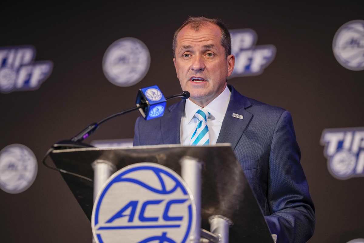 ACC commish Jim Phillips talks to reporters.