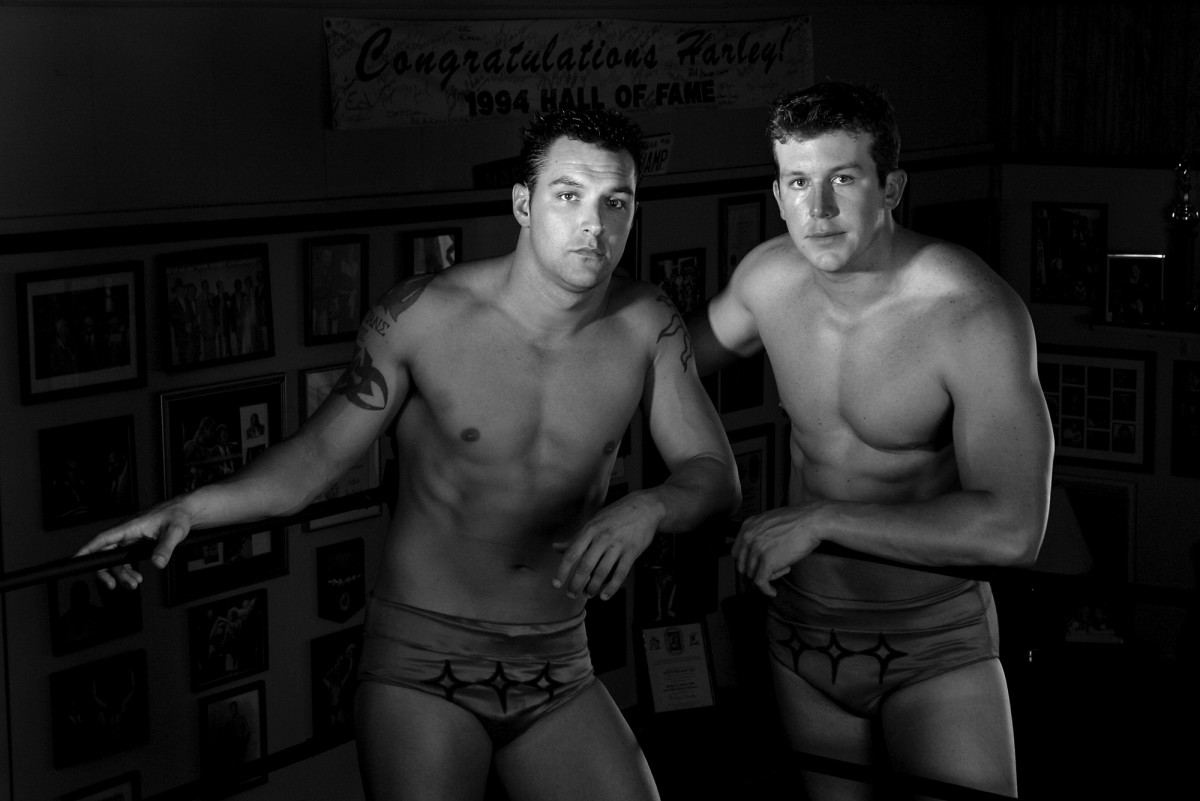Teddy DiBiase Jr. (right) followed his father, the Million Dollar Man, into wrestling before becoming embroiled in the welfare scandal. He is pictured here with brother Mike; his other brother, Brett, also pursued wrestling and became involved in the scandal.