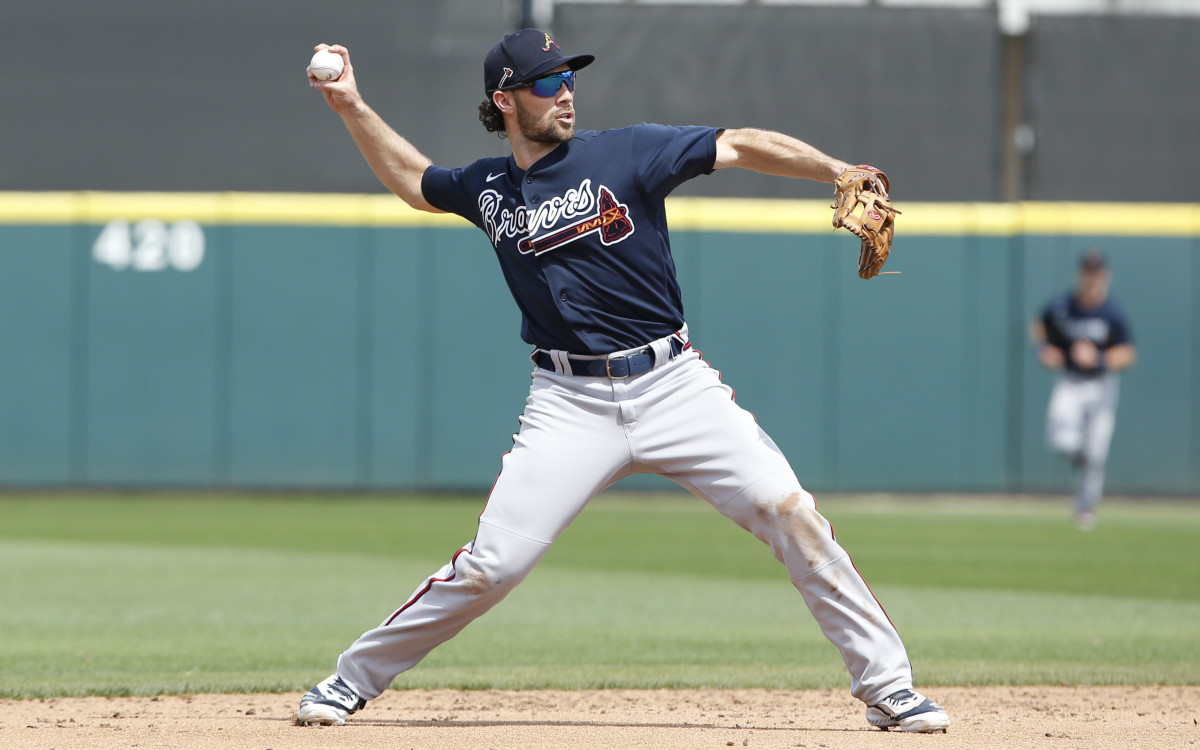 Mar 12, 2020; Lakeland, Florida, USA; Atlanta Braves infielder Charlie Culberson (8) thyrows to firsat for the inning ending out during the fourth inning against the Detroit Tigers at Publix Field at Joker Marchant Stadium.
