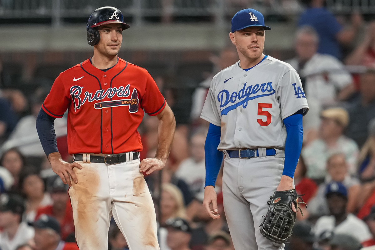 Jun 24, 2022; Cumberland, Georgia, USA; Atlanta Braves first baseman Matt Olson (28) on base next to Los Angeles Dodgers first baseman Freddie Freeman (5) during the ninth inning at Truist Park.