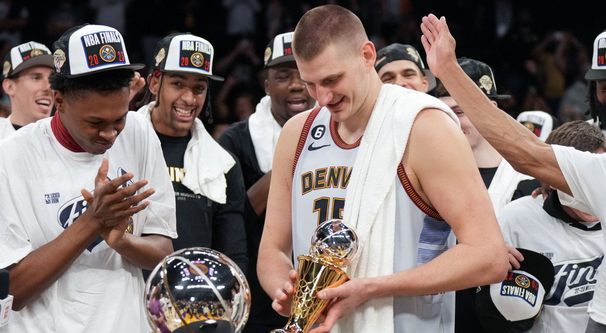Nikola Jokić celebrates winning the Western Conference MVP trophy after the Nuggets defeated the Lakers in Game 4.