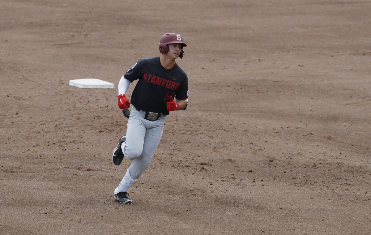 Jun 21, 2021; Omaha, Nebraska, USA; Stanford Cardinal designated hitter Tommy Troy (12) rounds the bases after hitting a home run against the Arizona Wildcats at TD Ameritrade Park. Mandatory Credit: Bruce Thorson-USA TODAY Sports