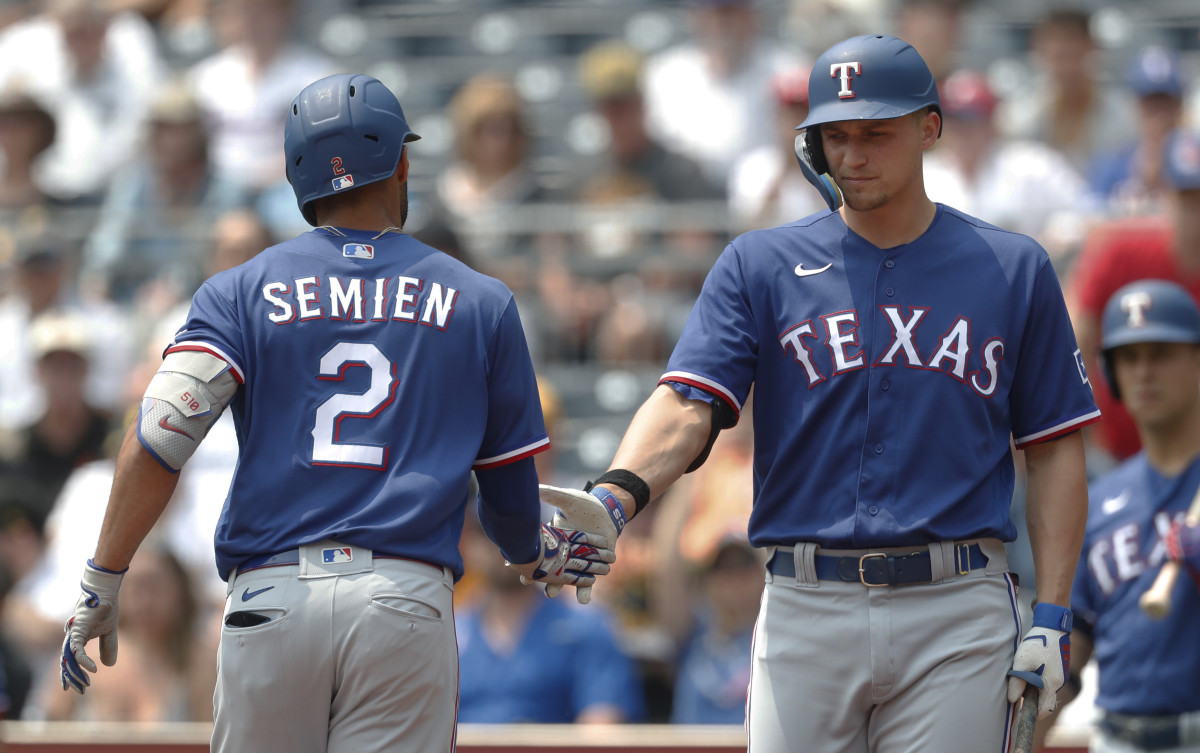 May 24, 2023; Pittsburgh, Pennsylvania, USA; Texas Rangers designated hitter Corey Seager (right) greets second baseman Marcus Semien (2) after hitting a solo home run against the Pittsburgh Pirates during the first inning at PNC Park. Mandatory Credit: Charles LeClaire-USA TODAY Sports