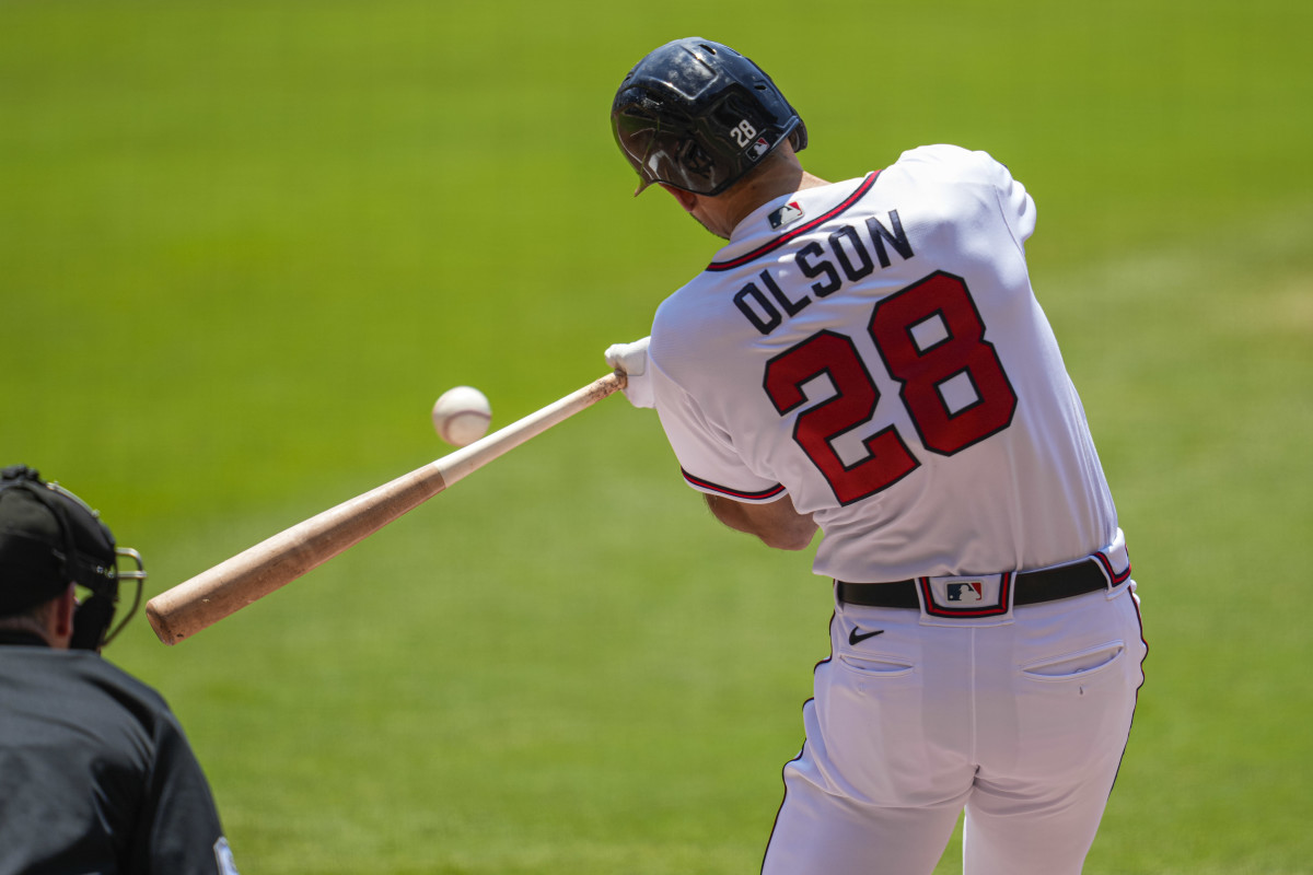 Jun 28, 2023; Cumberland, Georgia, USA; Atlanta Braves first baseman Matt Olson (28) hits a double to drive in a run against the Minnesota Twins during the first inning at Truist Park. Mandatory Credit: Dale Zanine-USA TODAY Sports