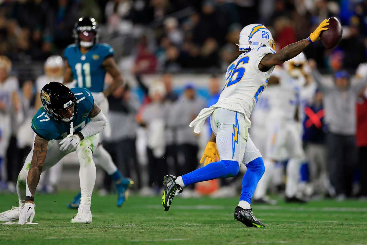 cornerback Asante Samuel Jr. runs with the ball lifted in one hand