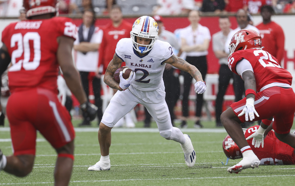 Sep 17, 2022; Houston, Texas, USA; Kansas Jayhawks wide receiver Lawrence Arnold (2) runs with the ball during the second quarter against the Houston Cougars at TDECU Stadium. Mandatory Credit: Troy Taormina-USA TODAY Sports
