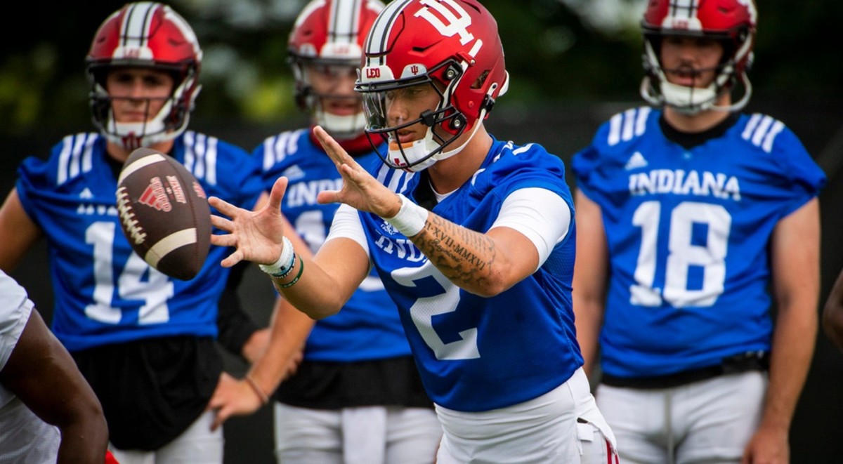 Indiana's Tayven Jackson (2) takes the snap during the first day of fall camp for Indiana football at their practice facilities on Wednesday, Aug. 2, 2023.