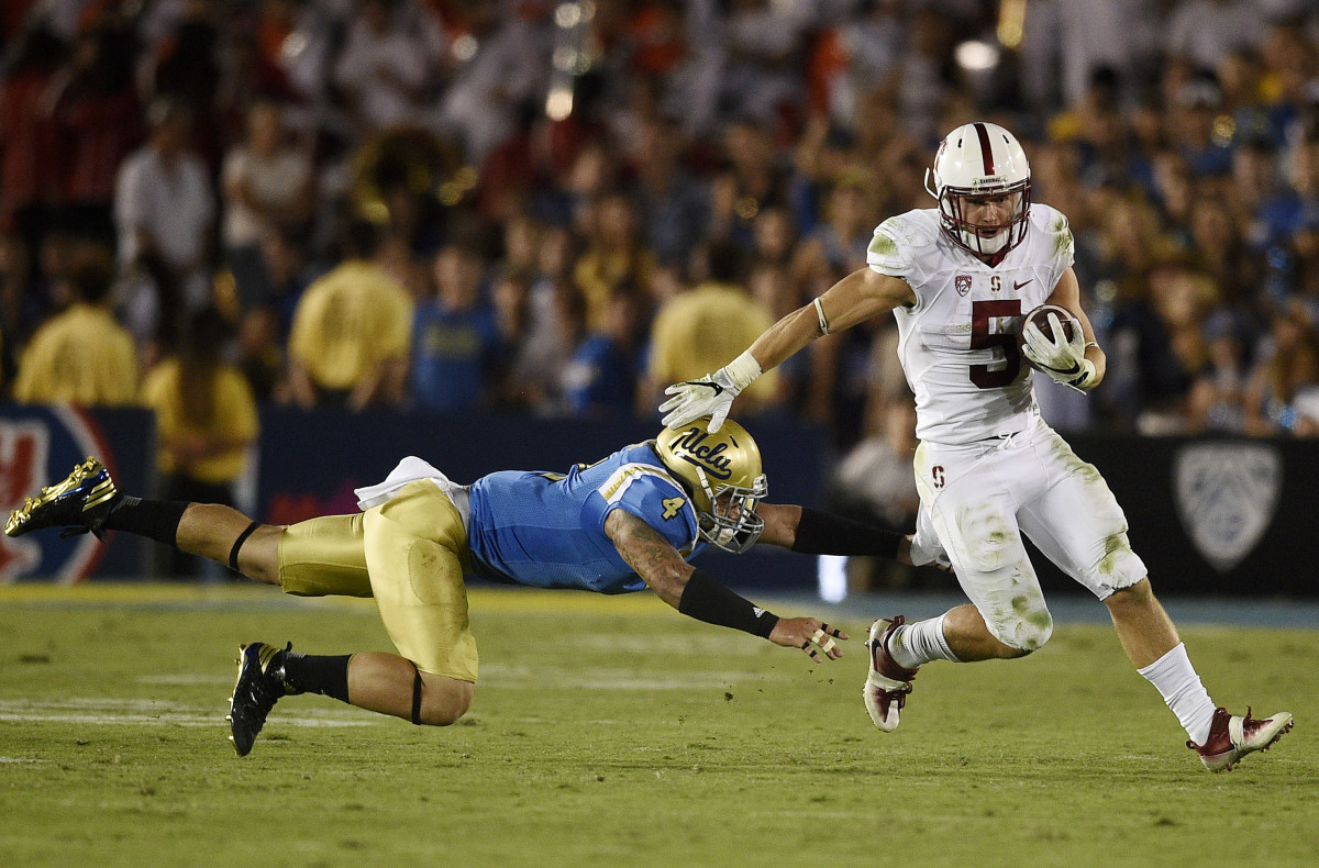 Sep 24, 2016; Pasadena, CA, USA; Stanford Cardinal running back Christian McCaffrey (5) runs the ball past UCLA Bruins linebacker Cameron Judge (4) during the second half at Rose Bowl. The Stanford Cardinal won 22-13. Mandatory Credit: Kelvin Kuo-USA TODAY Sports