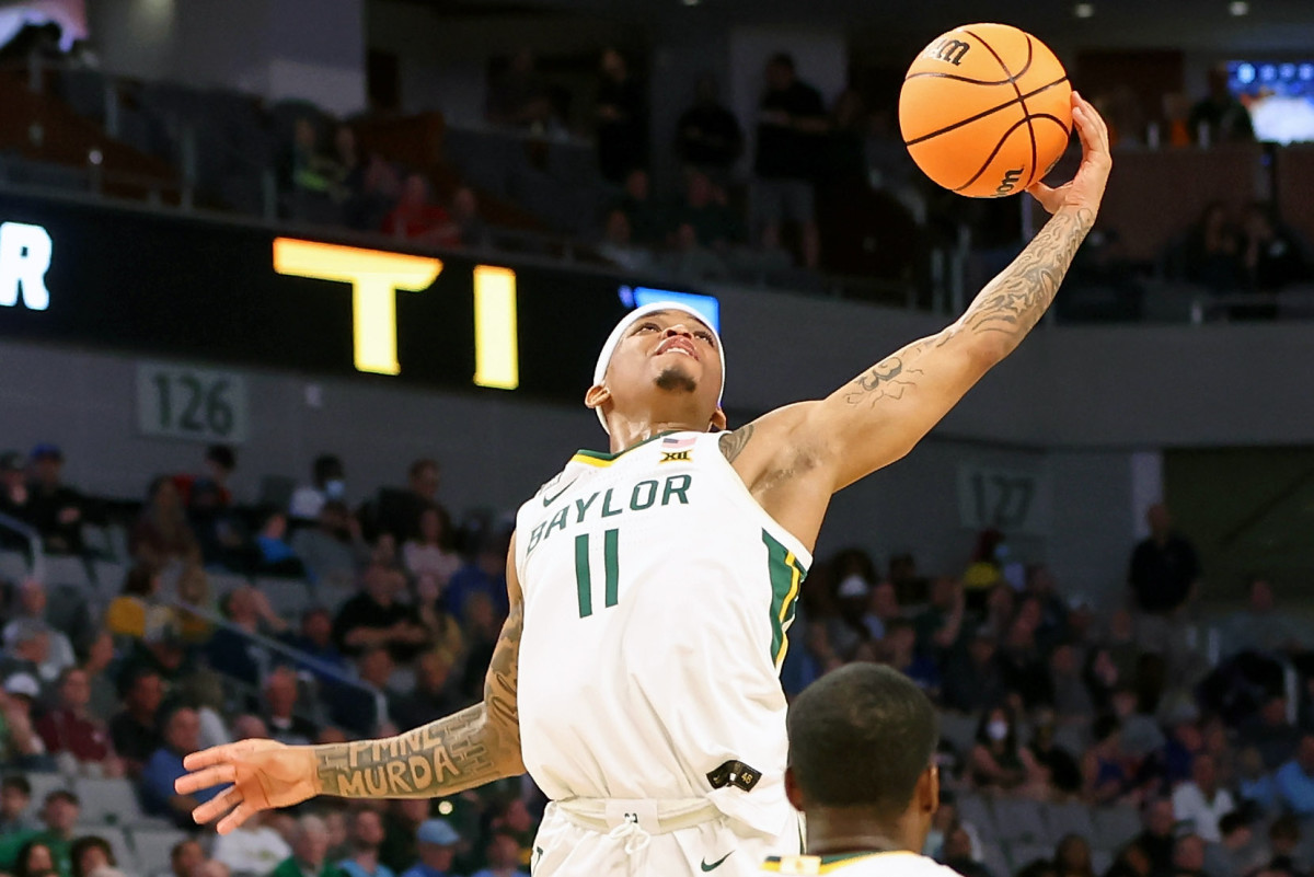 Baylor Bears guard James Akinjo (11) grabs a loose ball against the Norfolk State Spartans during the first half during the first round of the 2022 NCAA Tournament at Dickies Arena.
