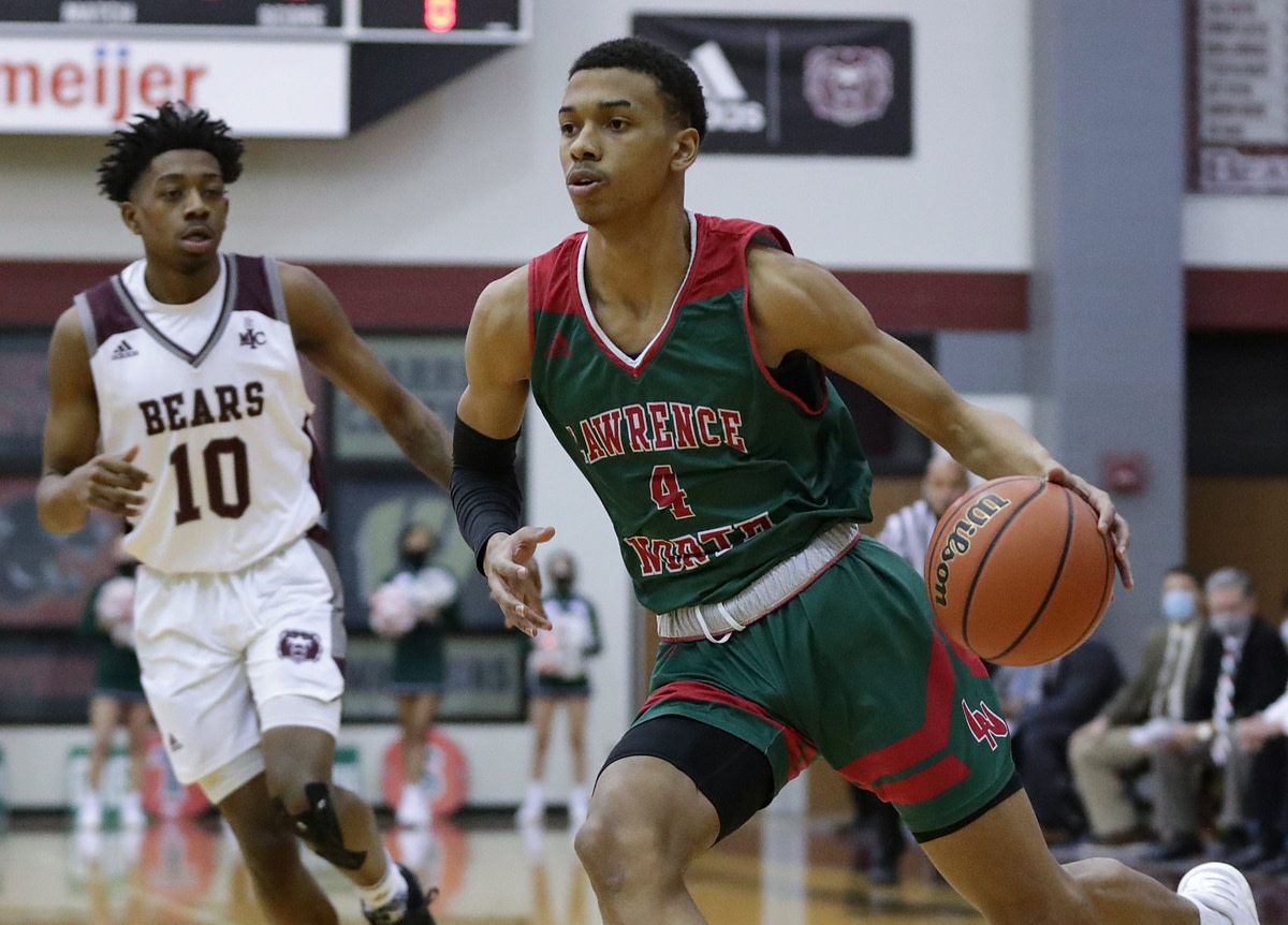 Lawrence North Wildcats junior CJ Gunn (4) drives to the basket during the first quarter of the game Wednesday, Jan. 13, 2021, at Lawrence Central High School in Indianapolis. Lawrence North won, 81-67. 