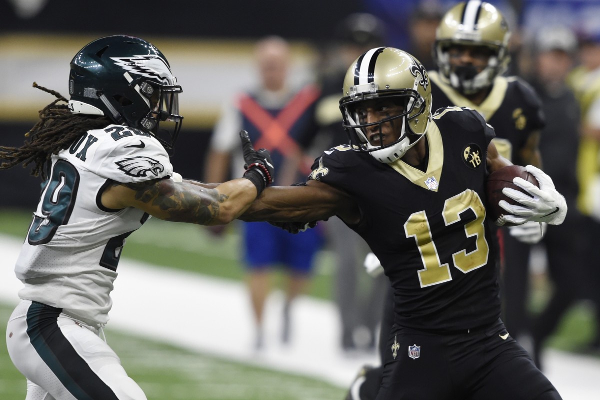 New Orleans Saints receiver Michael Thomas (13) stiff arms Philadelphia Eagles safety Avonte Maddox (29). Mandatory Credit: John David Mercer-USA TODAY Sports