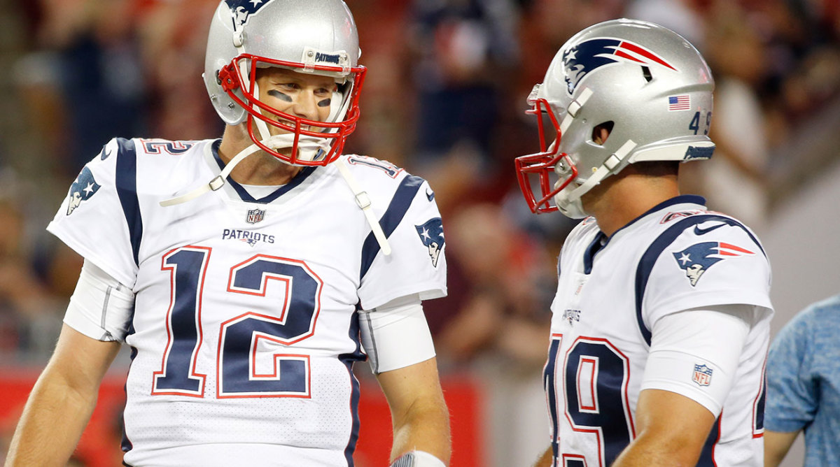 Joe Cardona talking to Tom Brady on the field