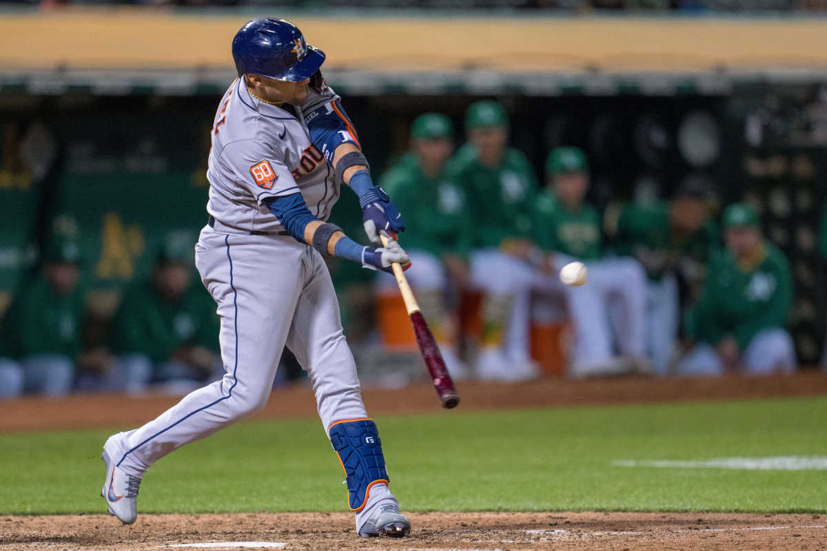 Yuli Gurriel slugs a single in the ninth innings against the Oakland Athletics.
