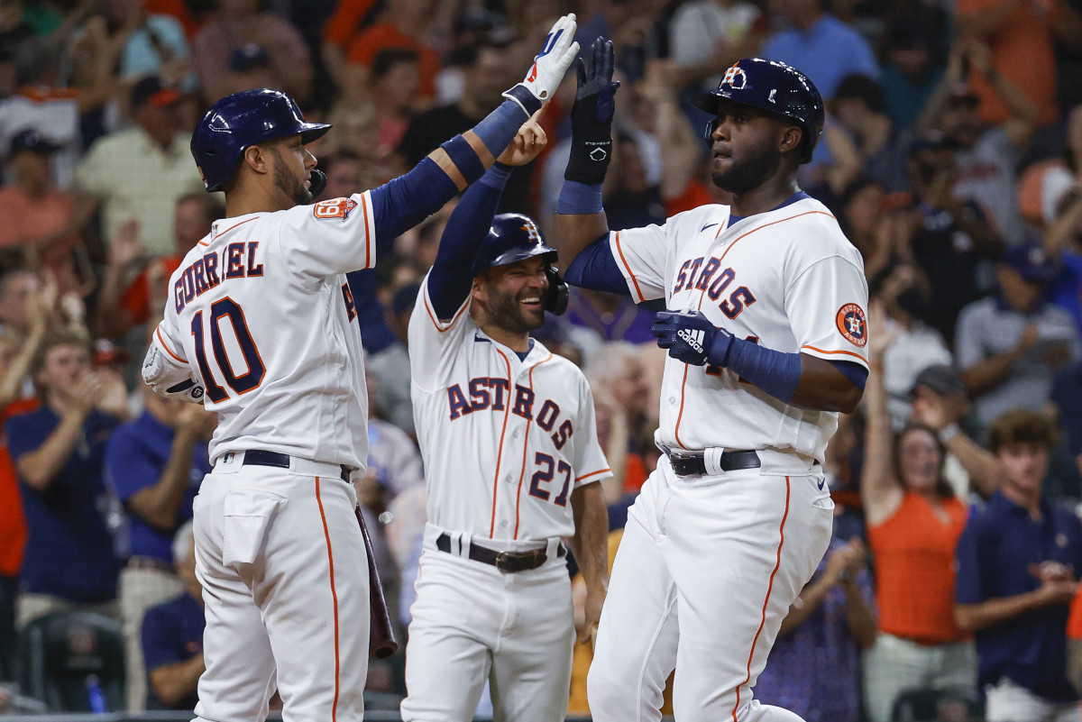 Houston Astros' Yordan Álvarez, José Altuve and Yuri Gurriel
