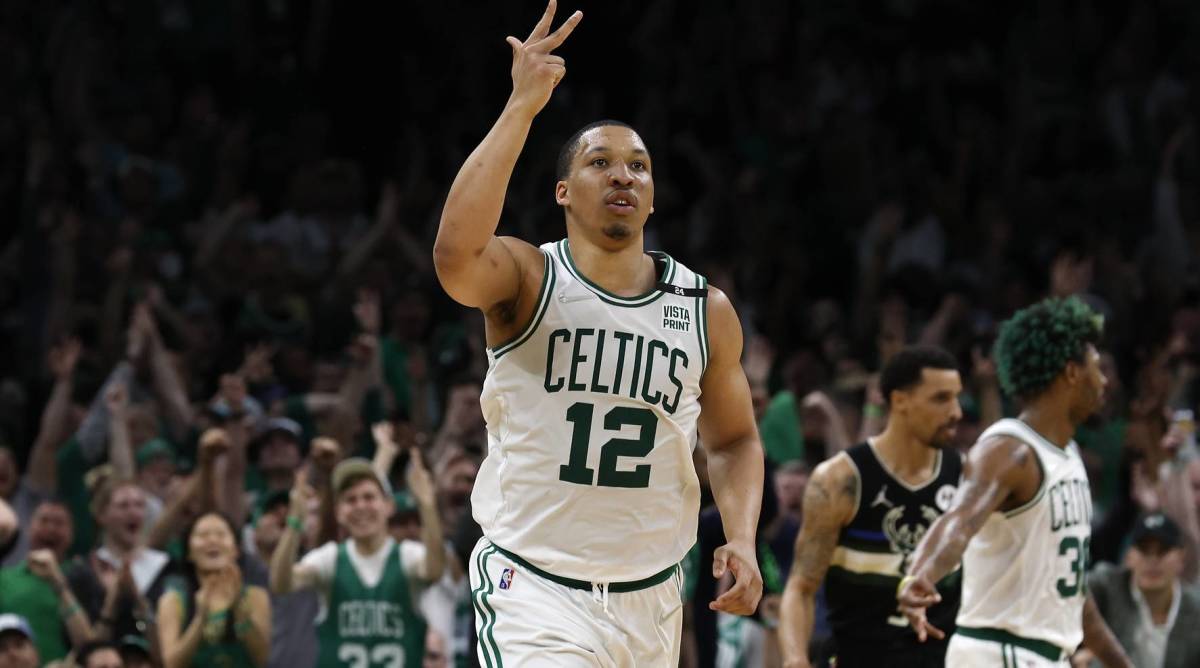 Grant Williams celebrates making a three-pointer vs. Milwaukee Bucks.