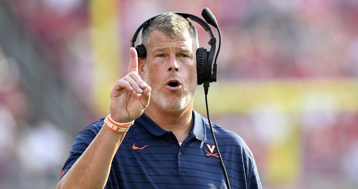 Virginia Cavaliers offensive line coach Garett Tujague reacts during the second half against the Louisville Cardinals at Cardinal Stadium.