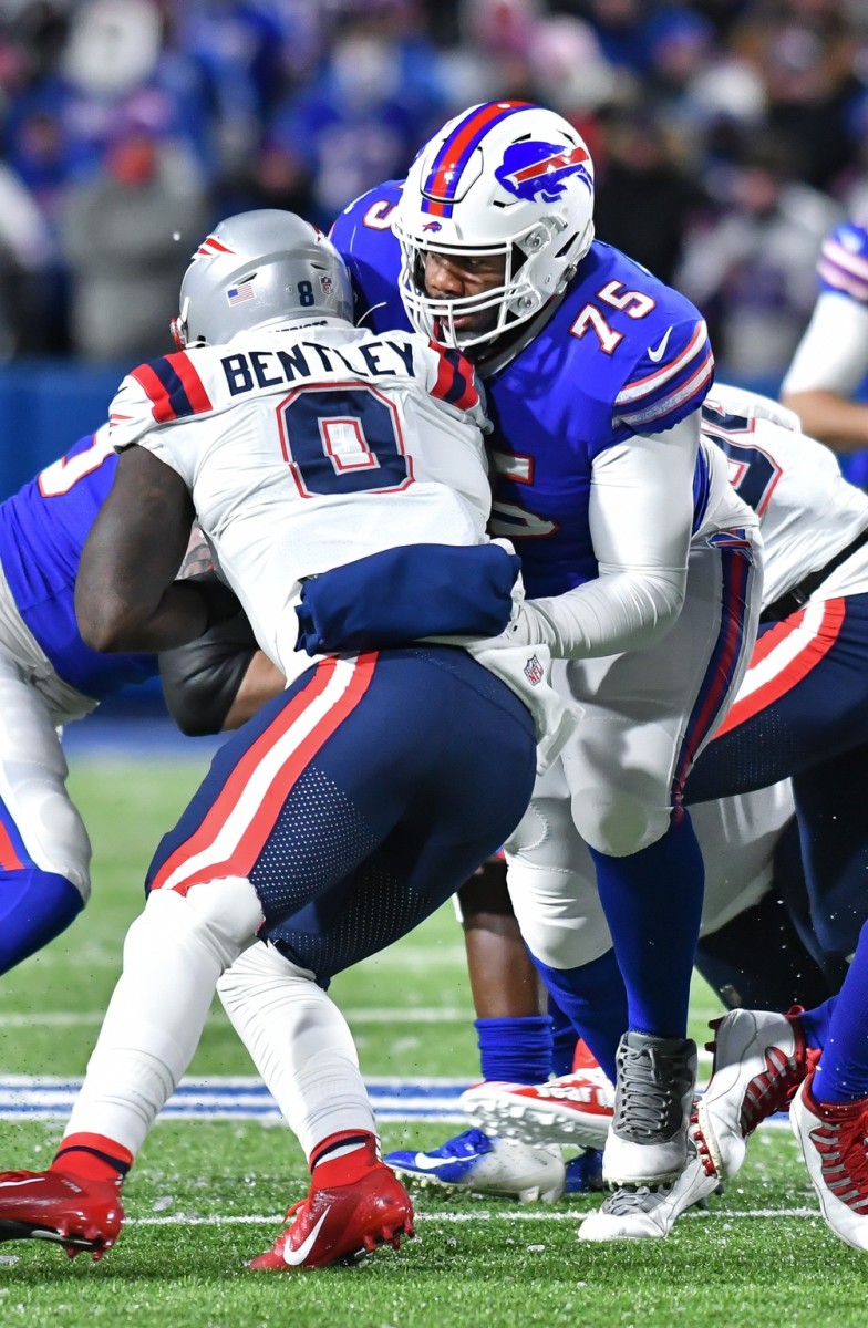 Dec 6, 2021; Buffalo Bills offensive tackle Daryl Williams (75) blocks New England Patriots linebacker Ja'Whaun Bentley (8). Mandatory Credit: Mark Konezny-USA TODAY