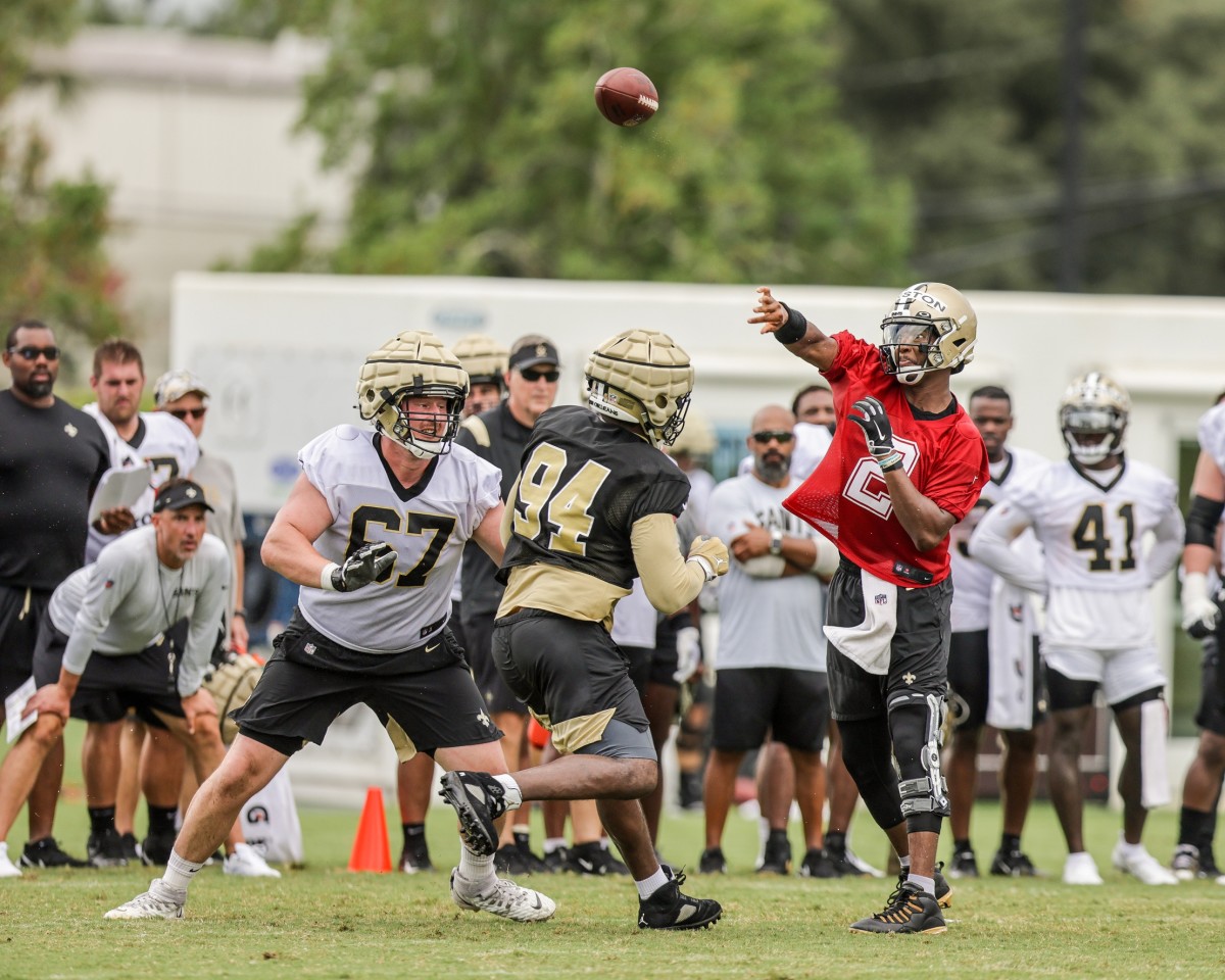 New Orleans Saints quarterback Jameis Winston (2) throws as tackle Landon Young (67) blocks defensive end Cameron Jordan (94) during training camp. Mandatory Credit: Stephen Lew-USA TODAY Sports