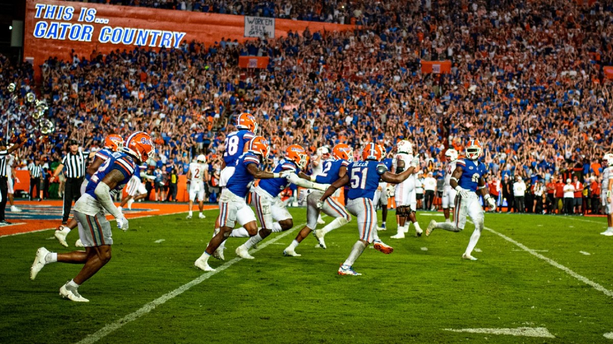 Amari Burney (2) and teammates celebrate Burney's walk-off interception in Florida's 2022 victory over Utah.
