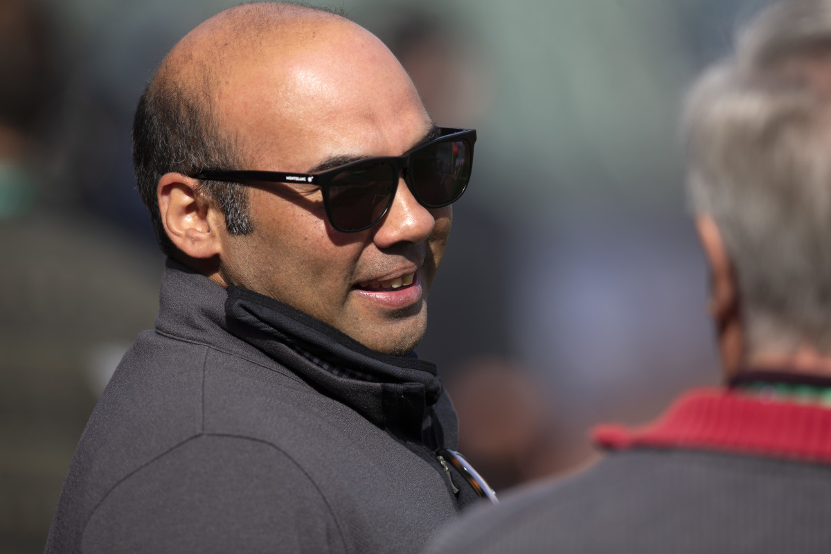 SF Giants president of baseball operations Farhan Zaidi talks with a reporter prior to a game in the 2021 NLDS.