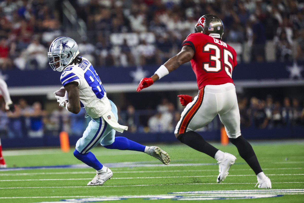 Sep 11, 2022; Arlington, Texas, USA; Dallas Cowboys wide receiver Noah Brown (85) runs with the ball as Tampa Bay Buccaneers cornerback Jamel Dean (35) defends during the first quarter at AT&T Stadium. Mandatory Credit: Kevin Jairaj-USA TODAY Sports