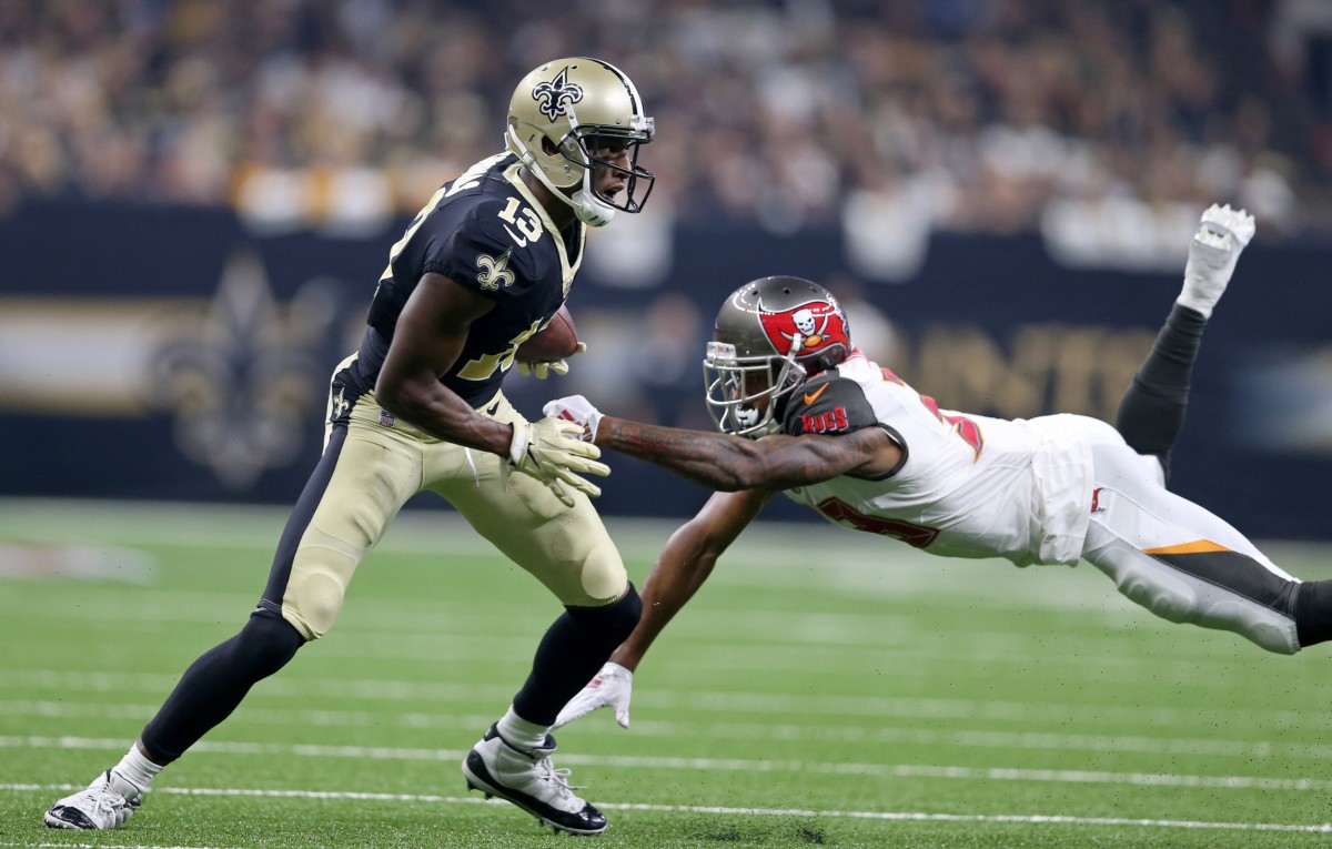Sep 9, 2018; New Orleans Saints receiver Michael Thomas (13) eludes Tampa Bay Buccaneers cornerback Carlton Davis (33). Mandatory Credit: Chuck Cook-USA TODAY
