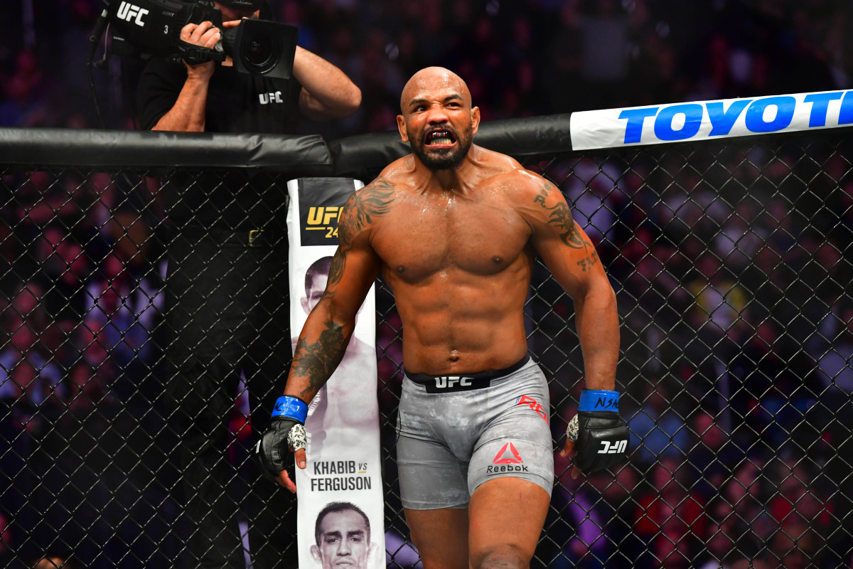 Israel Adesanya (red gloves) fights Yoel Romero (blue gloves) during UFC 248 at T-Mobile Arena.