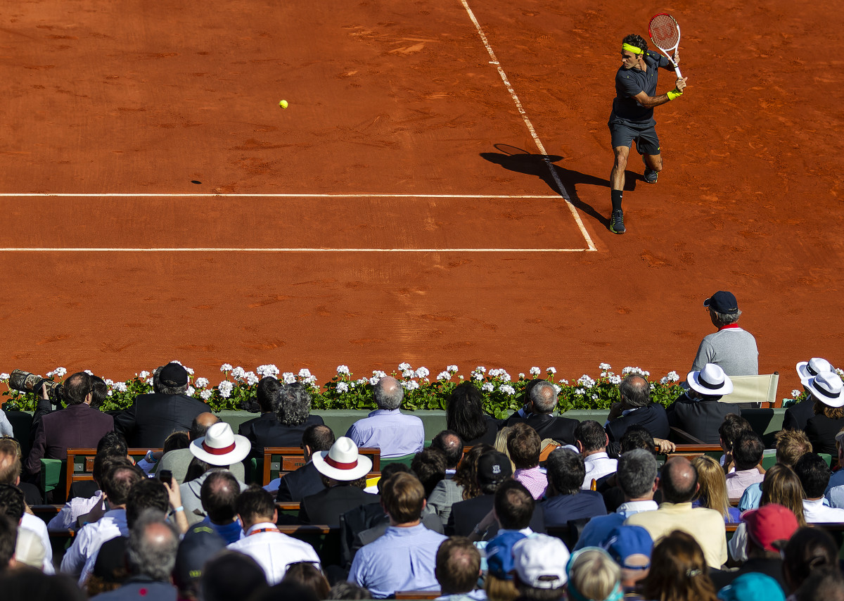 Federer delivers one of his smoothest shots, the backhand return.