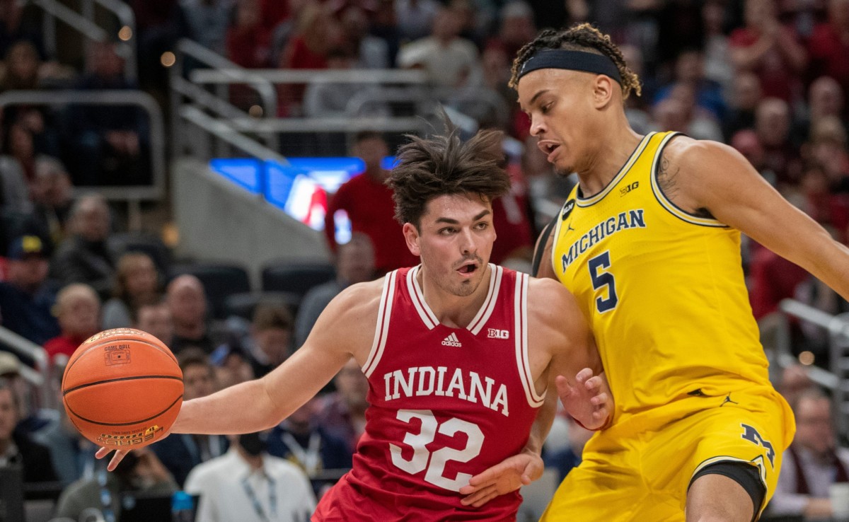 Indiana Hoosiers guard Trey Galloway (32) is defended by Michigan Wolverines forward Terrance Williams II (5), Thursday, March 10, 2022, during Big Ten tournament men s action from Indianapolis Gainbridge Fieldhouse. Indiana won 74-69.
