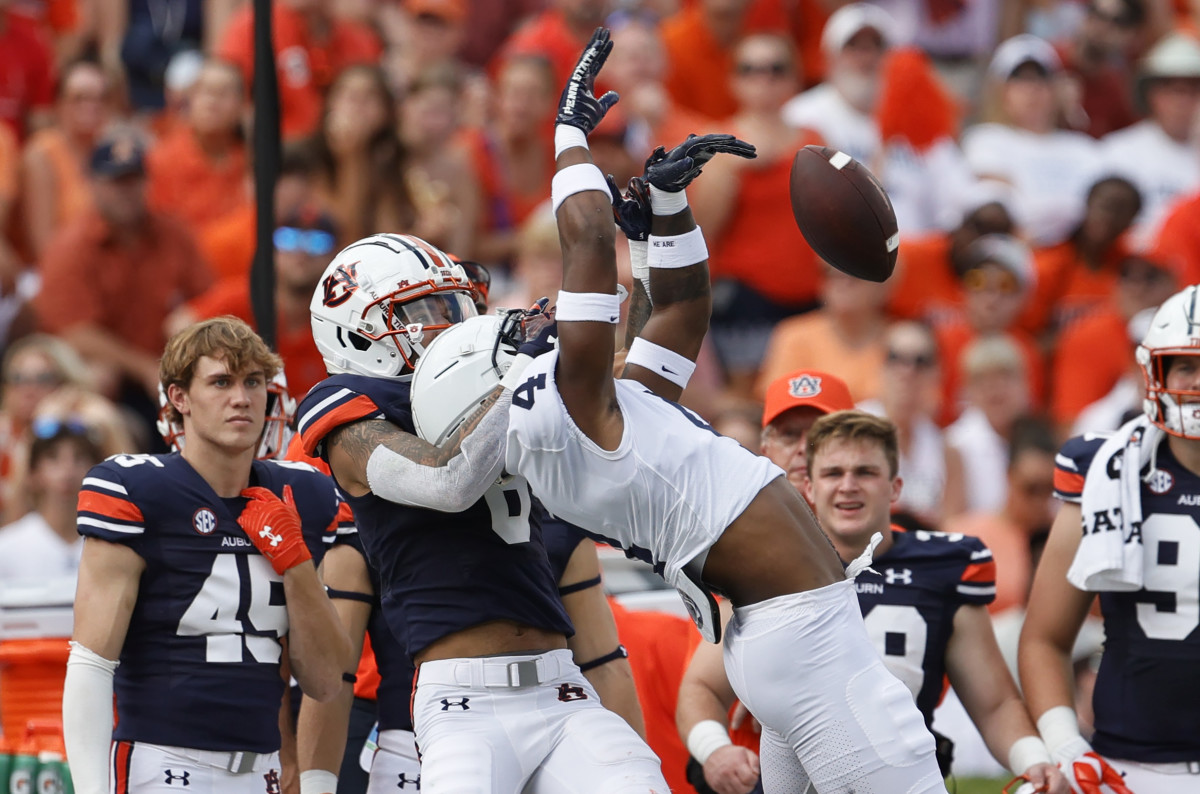 Sep 17, 2022; Auburn, Alabama, USA; Auburn Tigers wide receiver Dazalin Worsham (8) keeps Penn State Nittany Lions cornerback Kalen King (4) from the ball during the first quarter at Jordan-Hare Stadium. Mandatory Credit: John Reed-USA TODAY Sports