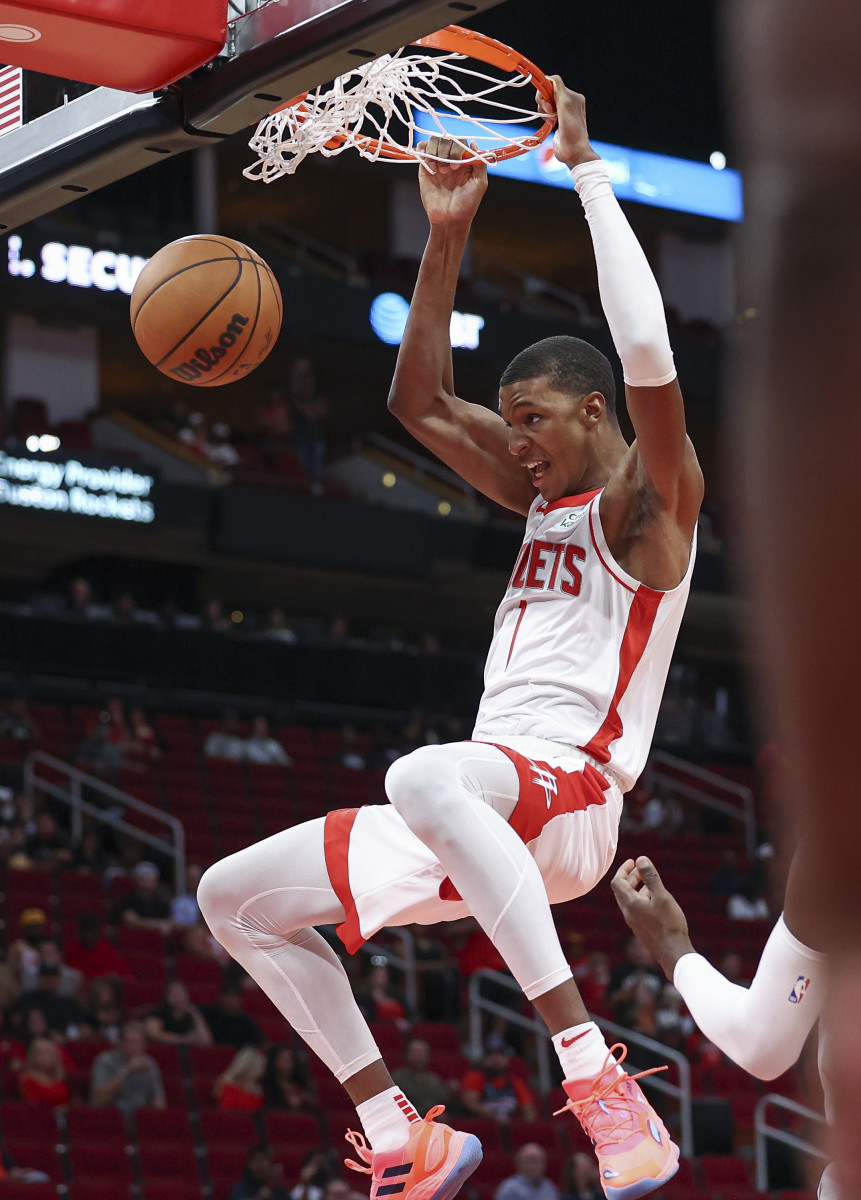 Oct 2, 2022; Houston, Texas, USA; Houston Rockets forward Jabari Smith Jr. (1) dunks the ball during the first quarter against the San Antonio Spurs at Toyota Center. Mandatory Credit: Troy Taormina-USA TODAY Sports