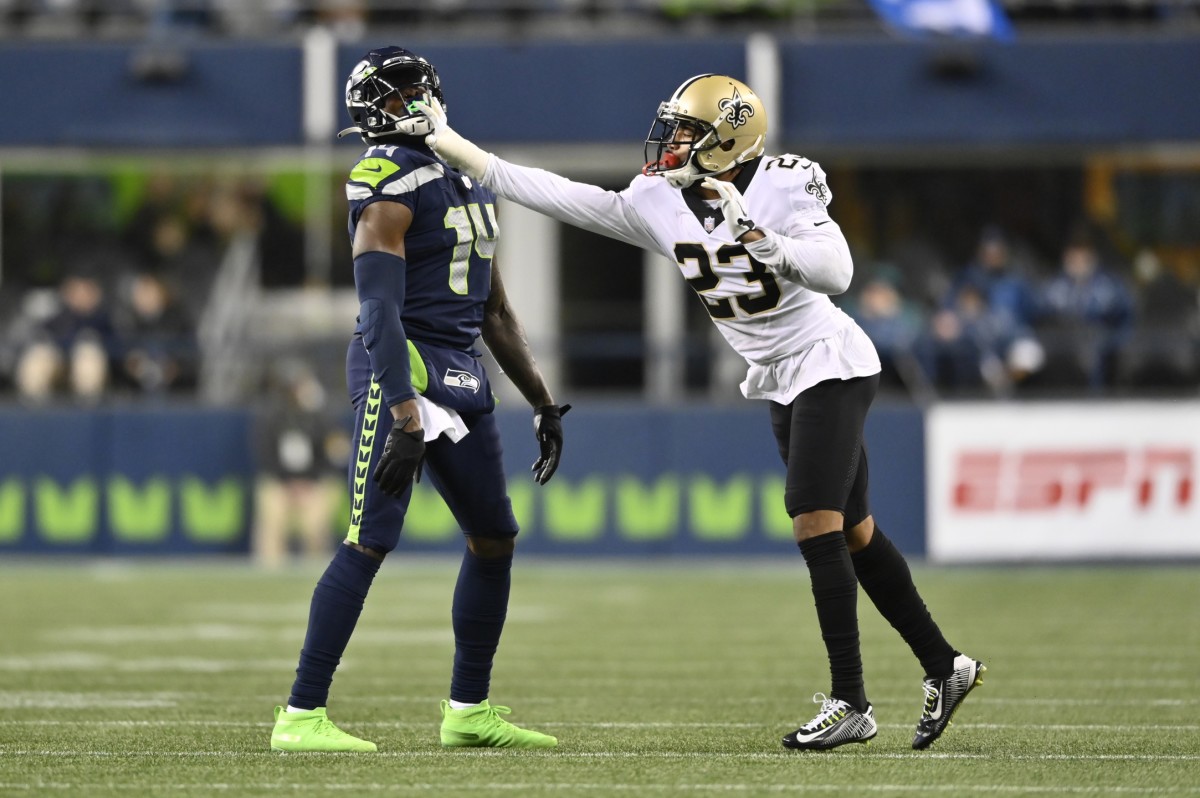 New Orleans Saints cornerback Marshon Lattimore (23) shoves Seattle Seahawks wide receiver DK Metcalf (14). Mandatory Credit: Steven Bisig-USA TODAY Sports