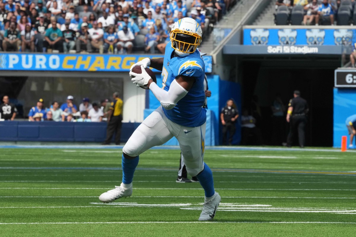Sep 25, 2022; Inglewood, California, USA; Los Angeles Chargers tight end Gerald Everett (7) carries the ball against the Jacksonville Jaguars in the first half at SoFi Stadium. Mandatory Credit: Kirby Lee-USA TODAY Sports